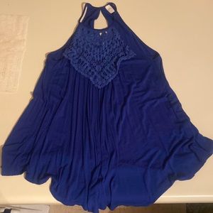 CY brand size L has a embroidered v shape chest flowy at the bottom